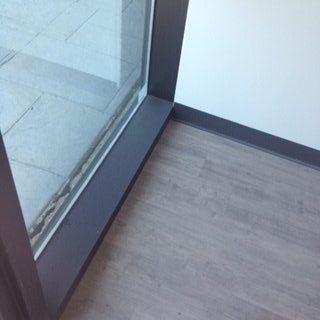 A building with many windows and doors on it.
